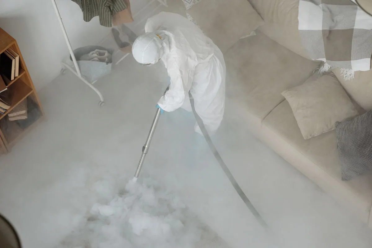 Biohazard cleanup technician in protective equipment, Jurupa Valley, CA